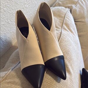 black cap toe booties similar to the Chanel letter logo booties but Cosy Island